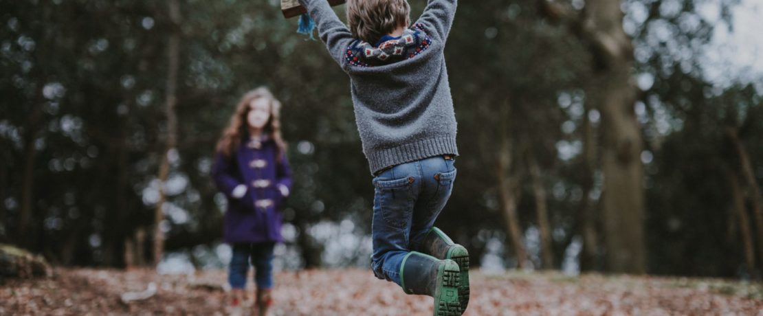 Children playing in woods